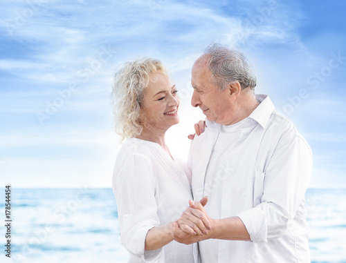 Happy senior couple at sea