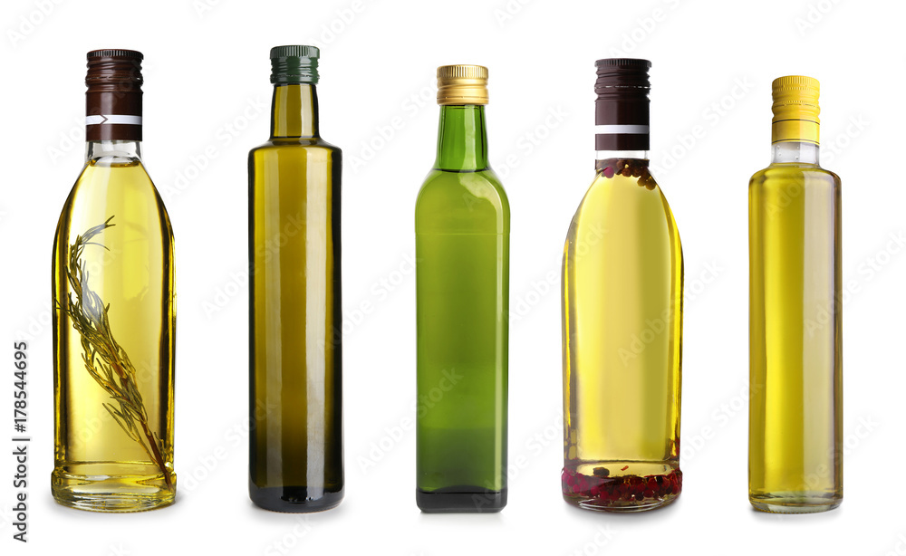 Bottles with different olive oil on white background Bottles with different olive oil on white background