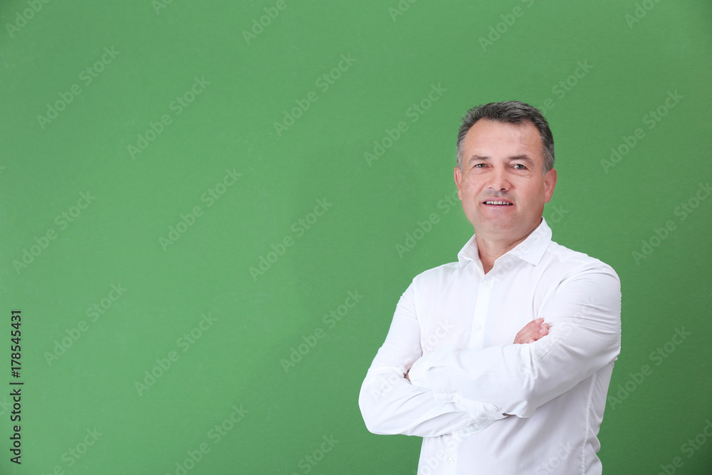 Mature man in white shirt on color background Mature man in white shirt on color background