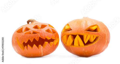 two spooky pumpkins on white background