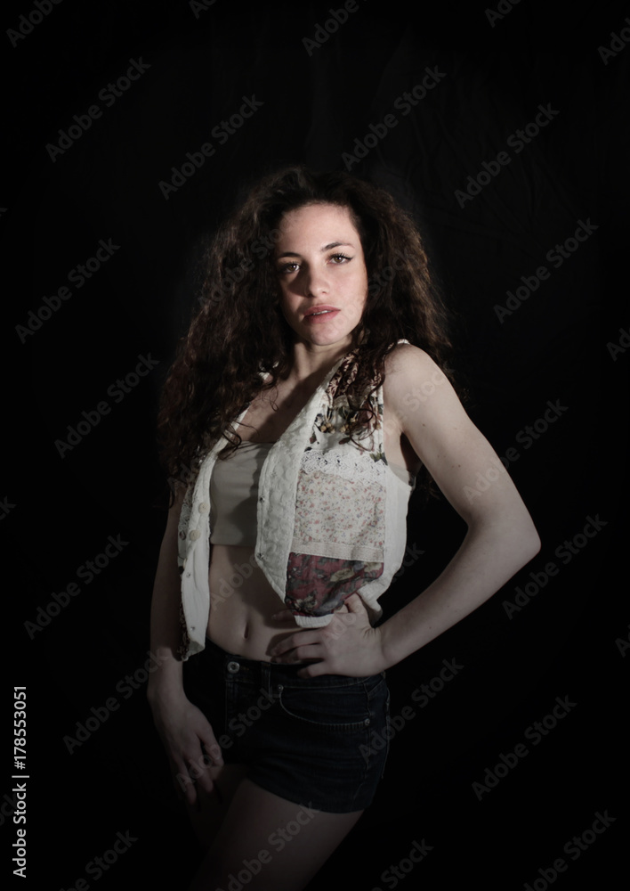 Fototapeta premium Beautiful teenage girl portrait on black background