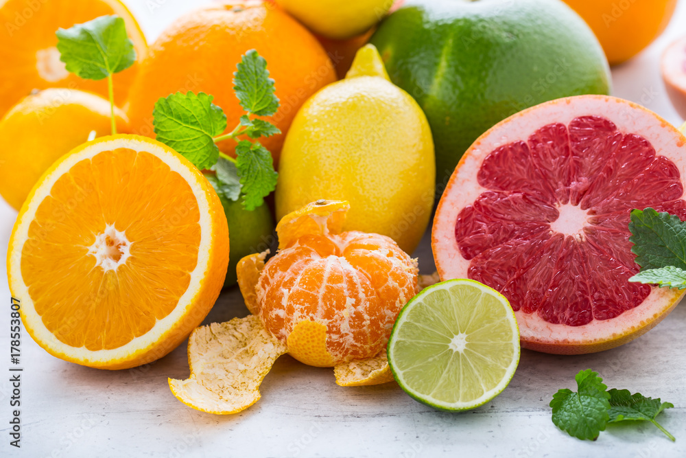 Citrus fresh fruit. Orange grapefruit lemon lime with mint leaves Citrus fresh fruit. Orange grapefruit lemon lime with mint leaves