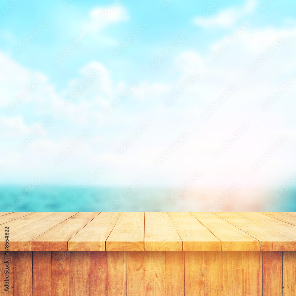 Wood table top on blur sea background. Summer, nature concepts. For montage product display or design key visual layout. Wood table top on blur sea background. Summer, nature concepts. For montage product display or design key visual layout.