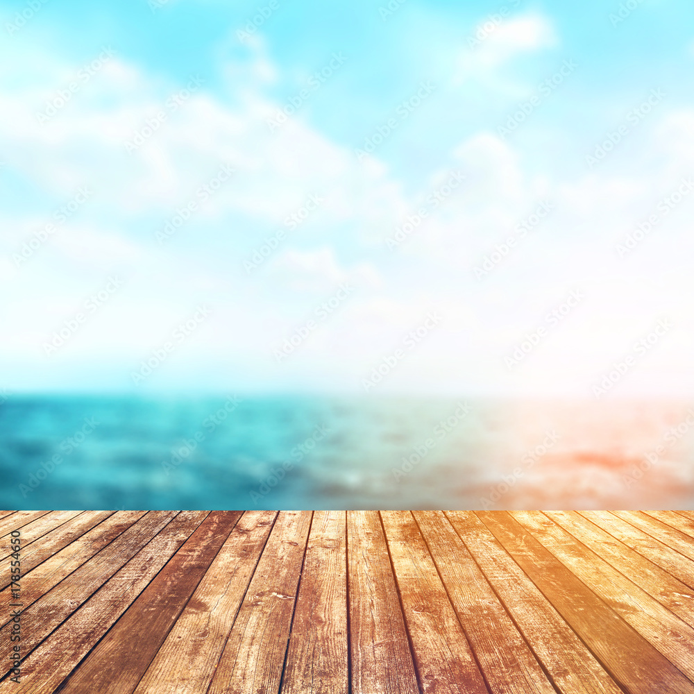 Wood table top on blur sea background. Summer, nature concepts. For montage product display or design key visual layout. Wood table top on blur sea background. Summer, nature concepts. For montage product display or design key visual layout.