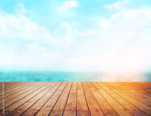 Wallpaper Mural Wood table top on blur sea background. Summer, nature concepts. For montage product display or design key visual layout. Torontodigital.ca
