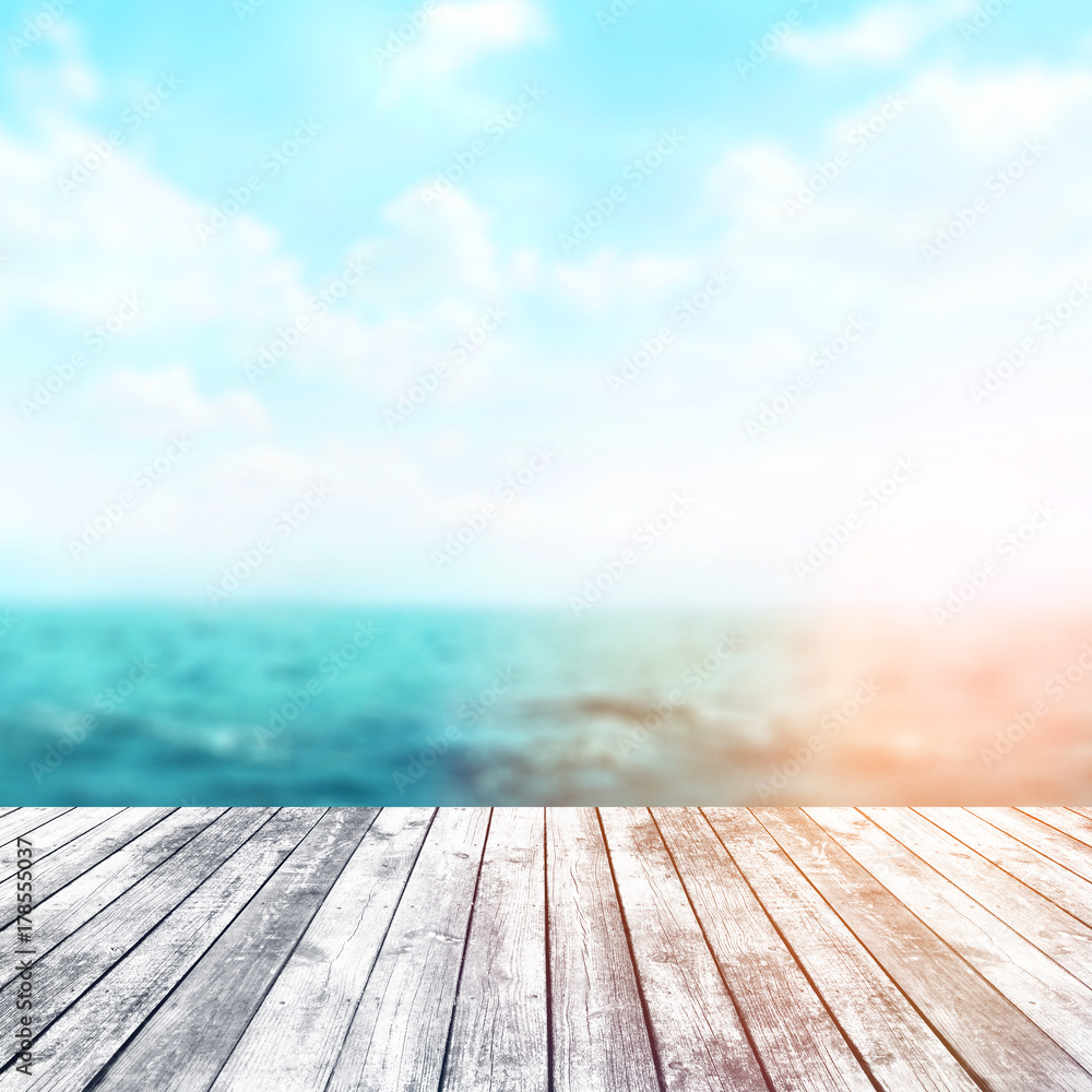 Wood table top on blur sea background. Summer, nature concepts. For montage product display or design key visual layout. Wood table top on blur sea background. Summer, nature concepts. For montage product display or design key visual layout.