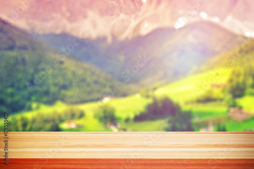 Wood table top on blur mountains background. Nature concepts. For montage product display or design key visual layout.