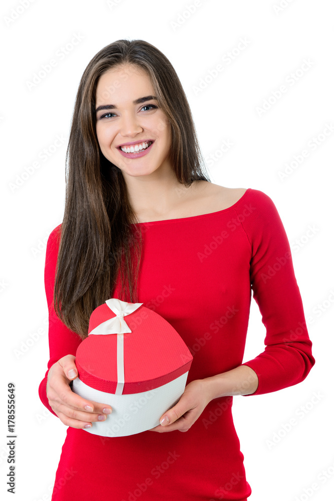 Beautiful happy smiling young woman holding red heart gift box with valentine's present inside, isolated on white background. Valentine's day image. Beautiful happy smiling young woman holding red heart gift box with valentine's present inside, isolated on white background. Valentine's day image.