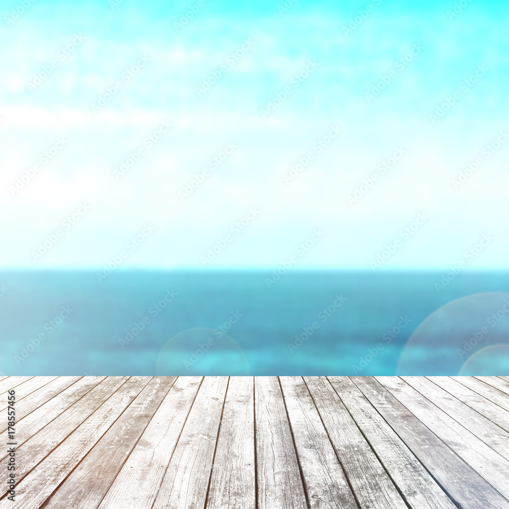 Wood table top on blur sea background. Summer, nature concepts. For montage product display or design key visual layout. Wood table top on blur sea background. Summer, nature concepts. For montage product display or design key visual layout.