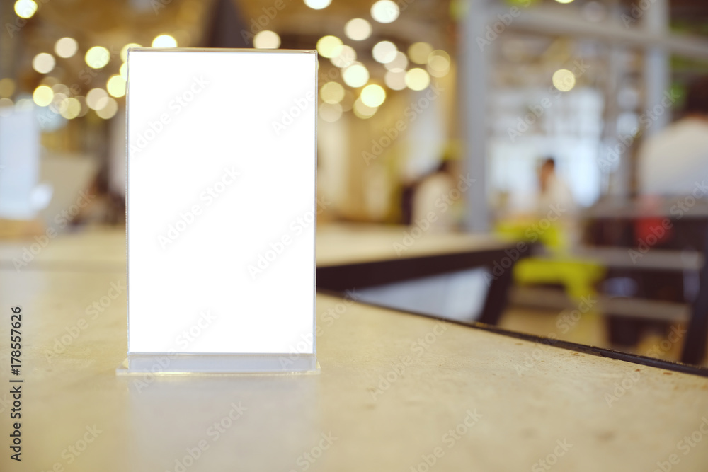 Mock up Menu frame standing on wood table in Bar restaurant cafe. space for text. Mock up Menu frame standing on wood table in Bar restaurant cafe. space for text.