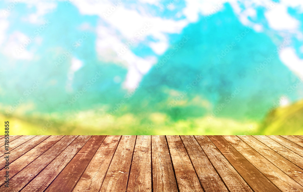 Wood table top on blur mountains background. Nature concepts. For montage product display or design key visual layout. Wood table top on blur mountains background. Nature concepts. For montage product display or design key visual layout.