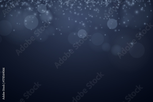 Glare bokeh on a dark background. Blue shine. Glowing particles. Celebratory background. Abstract light background. Vector