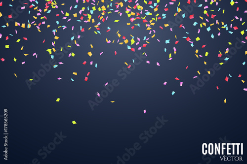 Many falling multicolored confetti on a dark blue background. Celebratory background on birthday. Place for your project. Vector