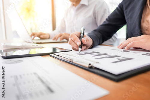 Administrator business man financial inspector and secretary making report, calculating balance. Internal Revenue Service checking document. Audit concept.