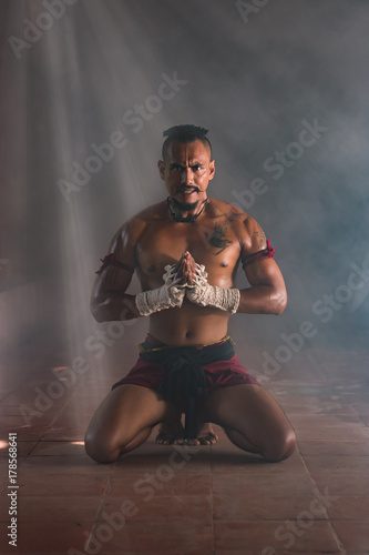 Fototapeta Naklejka Na Ścianę i Meble -  Muay Thai Chaiya Worshiper,Thai boxing is traditional boxing in Thailand