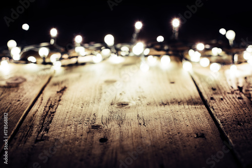 christmas lights on wooden table. copy space