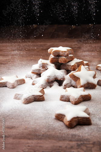Christmas homemade gingerbread cookies with sugar powder. star cookies