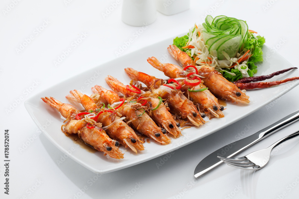 close up view of nice yummy fried shrimps on white back close up view of nice yummy fried shrimps on white back