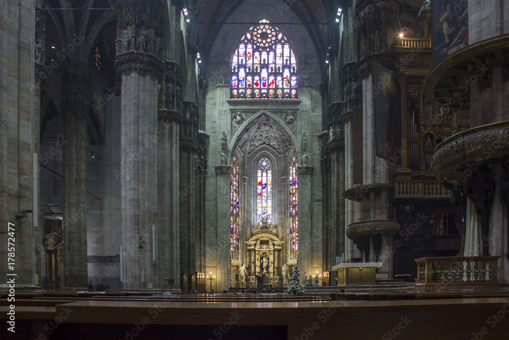 Obraz premium Duomo Catheral in Milan, interiors of the liturgic area with benches and the altar, no people