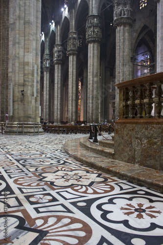 Inside Duomo cathedral in Milan, detail of the decorated floor in candoglia marble with flower pattern photo