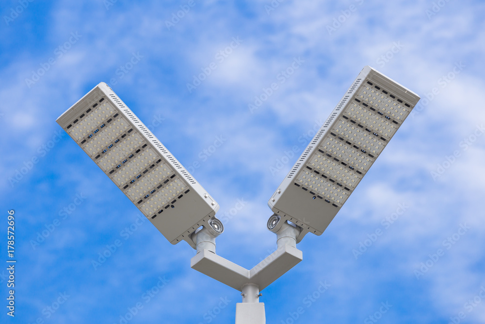 LED street light pole on blue sky with cloud