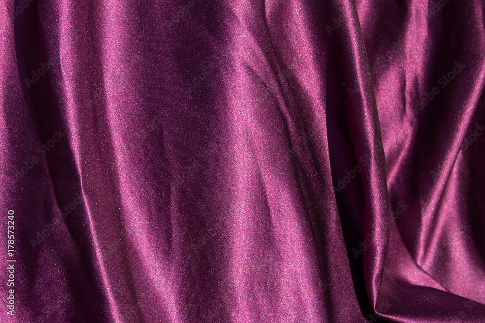 Obraz premium Purple satin background. Silk texture. Fabric pattern