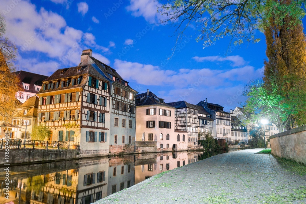 Typical house near water at night from La Petite France in Strasbourg, Alsace, France