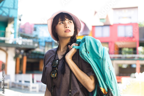 Portrait of Happy Traveler Woman in city. Woman with Travel Concept.