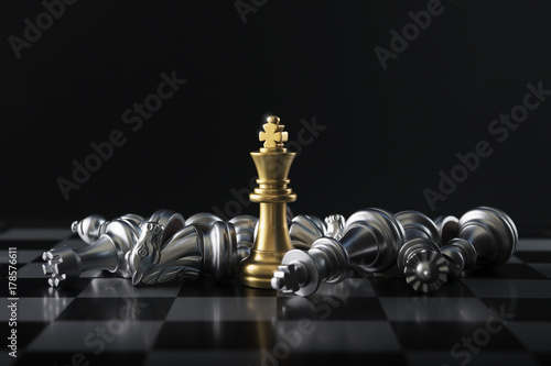 Chess (King wins the game) on black background. Success, business strategy, victory, win, winner, intellect, tactics, defeat, beat, knock, checkmate, leader or leadership concept. photo