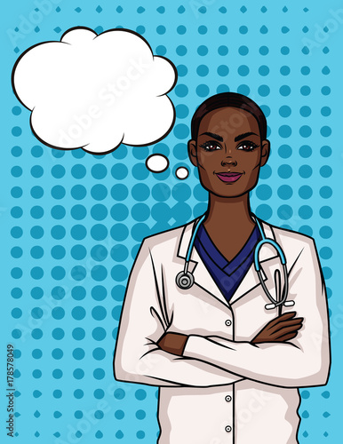 Portrait of a young Afro American female doctor in uniform. Happy woman doctor crossed her arms over her chest.