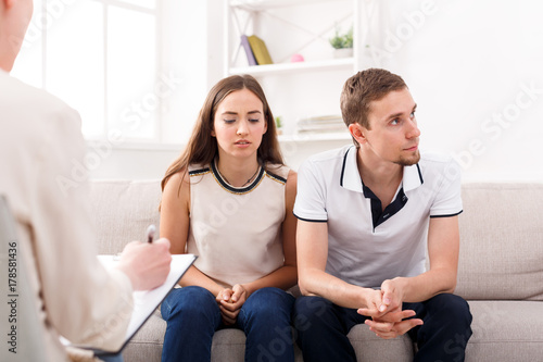 Young couple arguing during therapy session