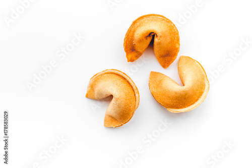 Chinese fortune cookie with prediction on white background top view space for text