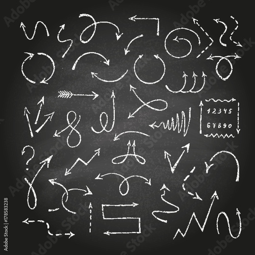 Arrows on black chalkboard