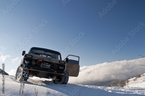 The SUV in the snowy mountains