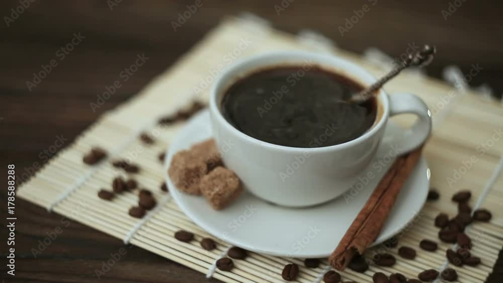 coffee with cinnamon in white cup on table coffee with cinnamon in white cup on table