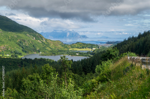 Forest in the foreground, blue mountains in the distance, Lofoten, Norway