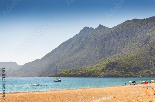 Sea beach in Turkey with mountain and yacht