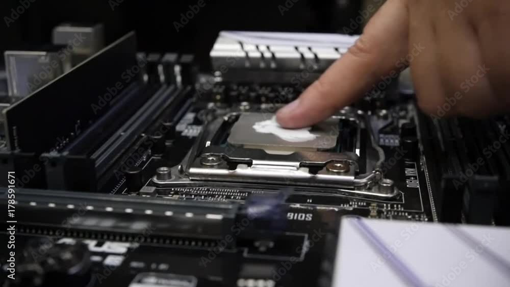 The master can finger a thermal paste on the processor. HD, 1920x1080. slow motion. The master can finger a thermal paste on the processor. HD, 1920x1080. slow motion.