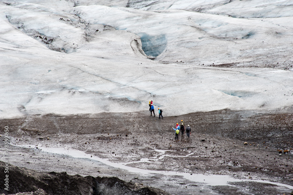 Hiking in Skaftafell, typical Icelandic landscape, a wild nature of rocks and shrubs, rivers and lakes.
