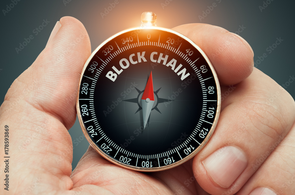hand holding compass and needle pointing blockchain word hand holding compass and needle pointing blockchain word
