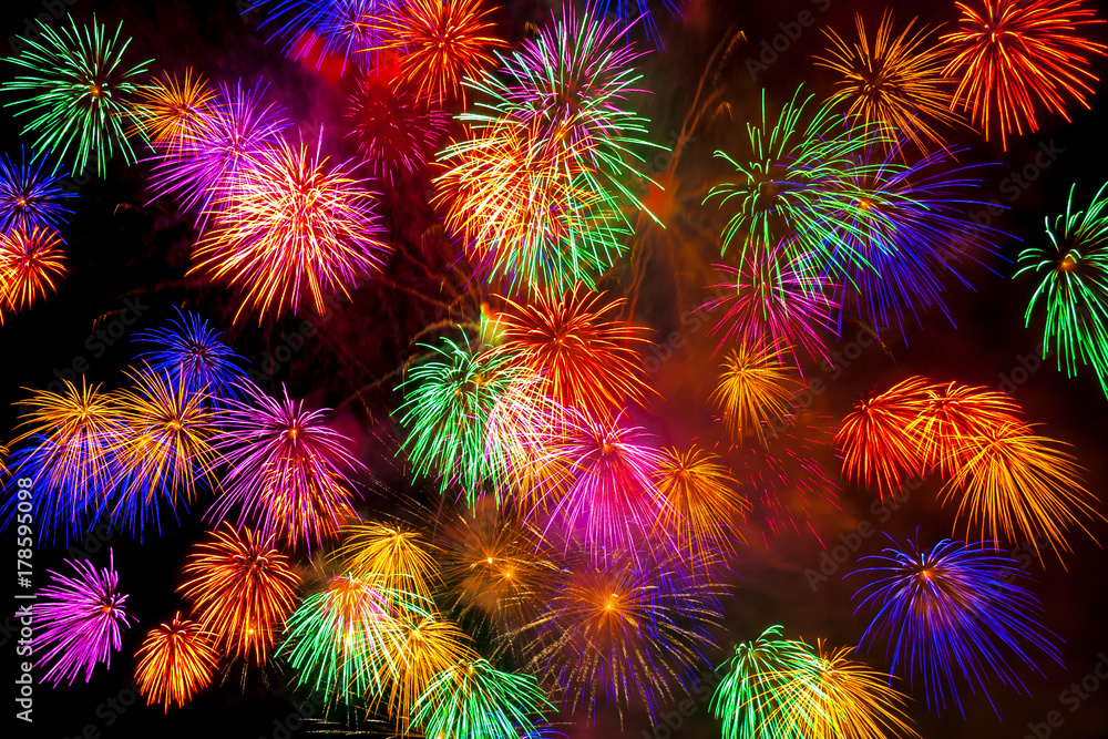 Fireworks display on dark sky background. Fireworks display on dark sky background.