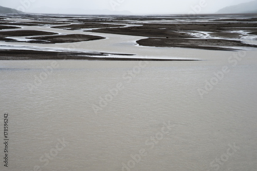 Typical Icelandic landscape, a wild nature of rocks and shrubs, rivers and lakes.