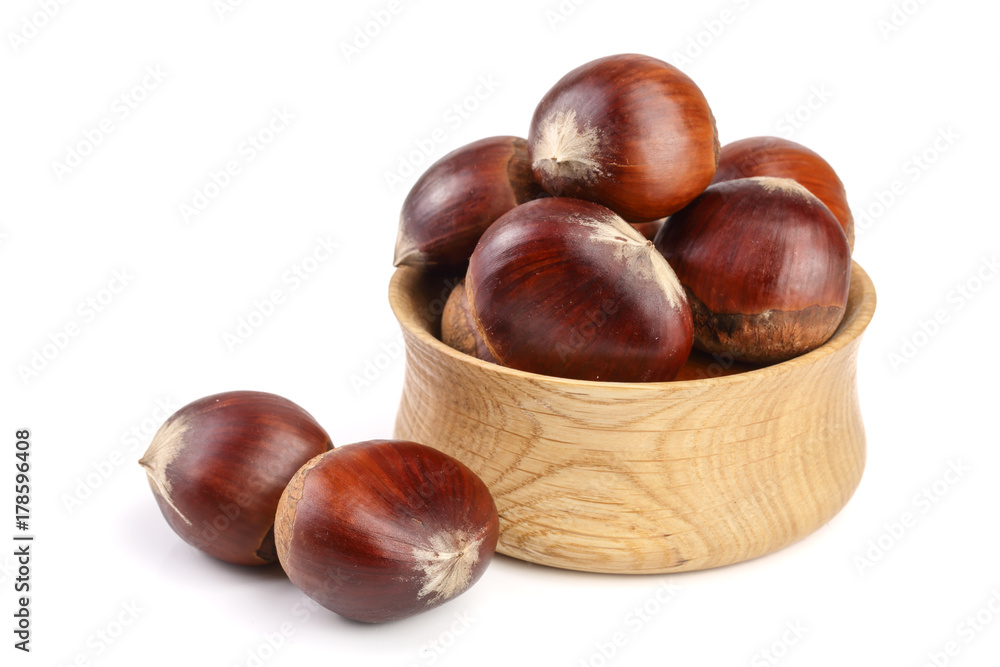 chestnut in a wooden bowl isolated on white background. Top view chestnut in a wooden bowl isolated on white background. Top view