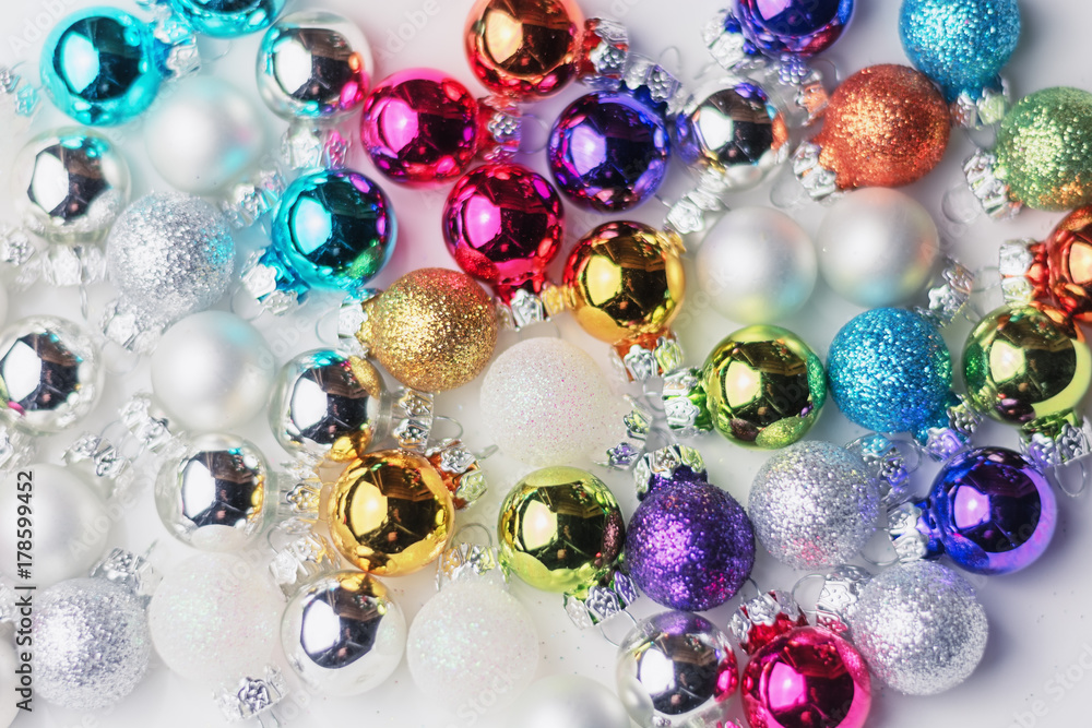 Collection of christmas balls in many colors in a white box Collection of christmas balls in many colors in a white box