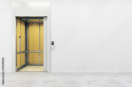 Room with elevator and empty wall