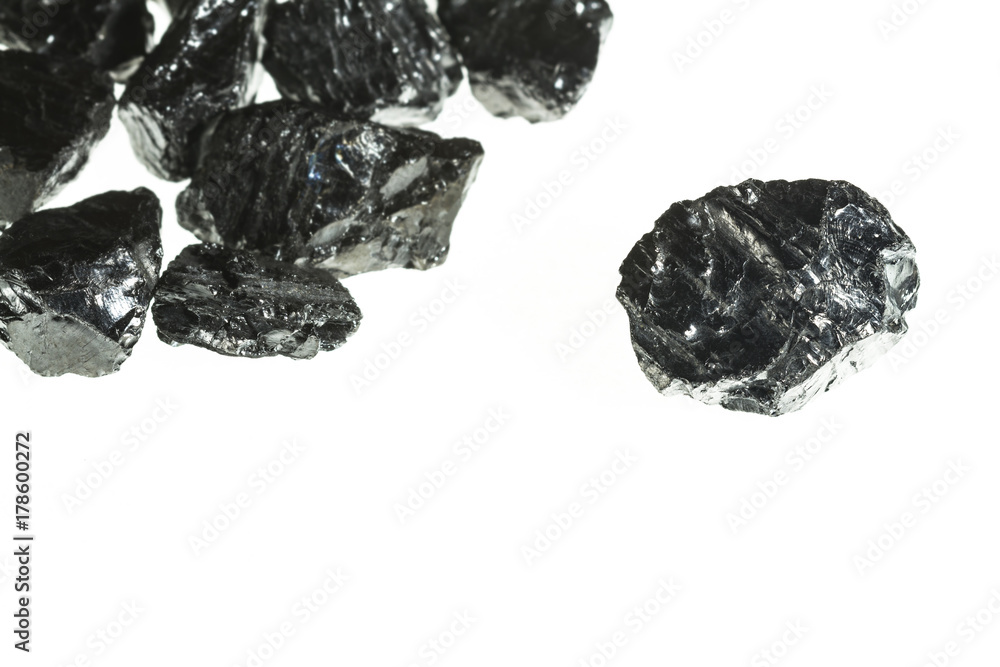 Black coal mine close-up with large depth of field. Anthracite coal bar isolated on white background Black coal mine close-up with large depth of field. Anthracite coal bar isolated on white background