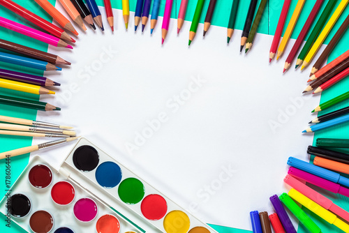 bright colors, pencils and school supplies on the table