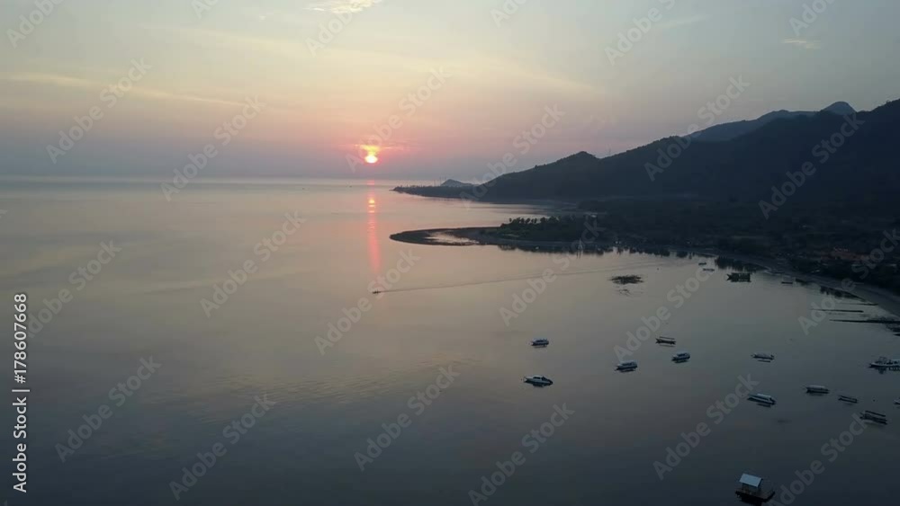 Pemuteran,Aerial view from drone,Stony seacoast and mountains on a sunset. Indonesia. Bali. Pemuteran,Aerial view from drone,Stony seacoast and mountains on a sunset. Indonesia. Bali.