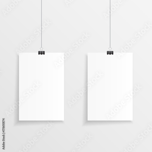 Realistic hanging papers with clips and shadow. Vector illustration of two hanging note or page with a clip, string and plenty of copy space.