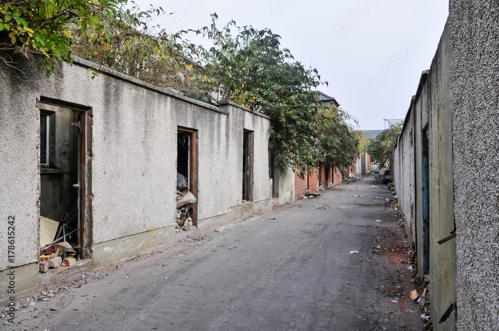 Back alley of derelict terraced houses ready to be demolished to make way for new homes